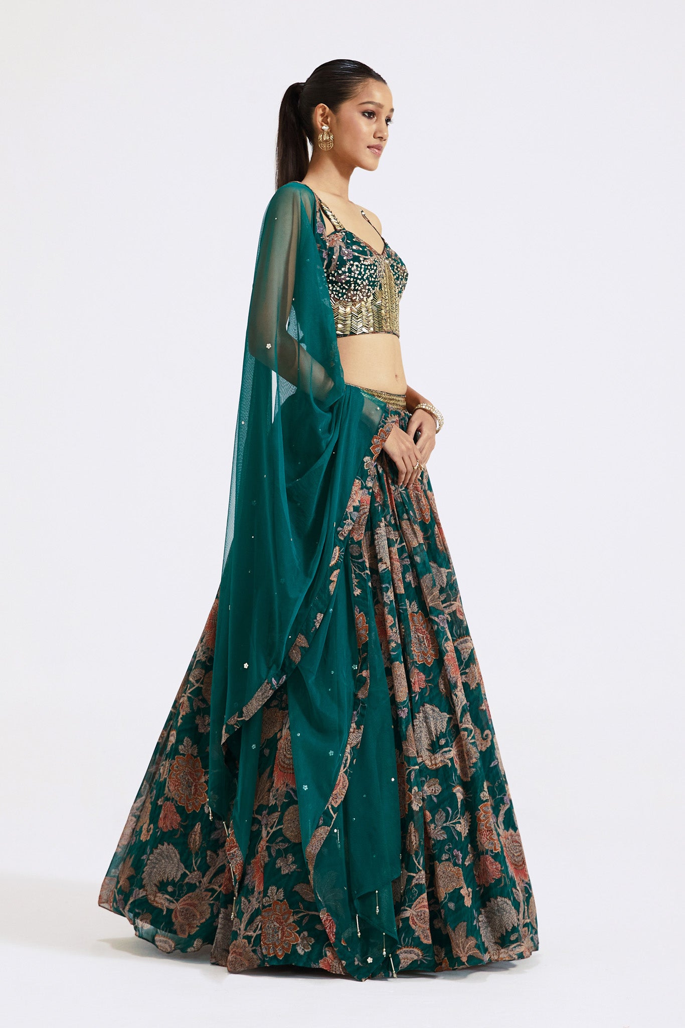 Shop dark green printed georgette lehenga online in USA with dupatta. Shop the best and latest designs in embroidered sarees, designer sarees, Anarkali suit, lehengas, sharara suits for weddings and special occasions from Pure Elegance Indian fashion store in USA.-side