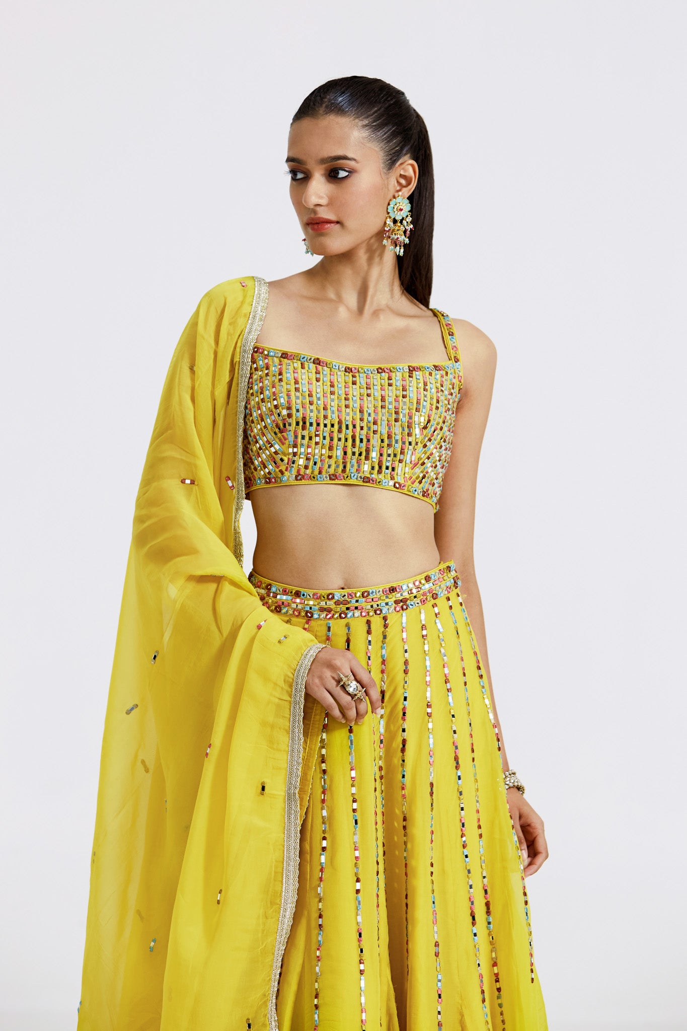Buy stunning lemon yellow embellished organza lehenga online in USA with dupatta. Shop the best and latest designs in embroidered sarees, designer sarees, Anarkali suit, lehengas, sharara suits for weddings and special occasions from Pure Elegance Indian fashion store in USA.-closeup
