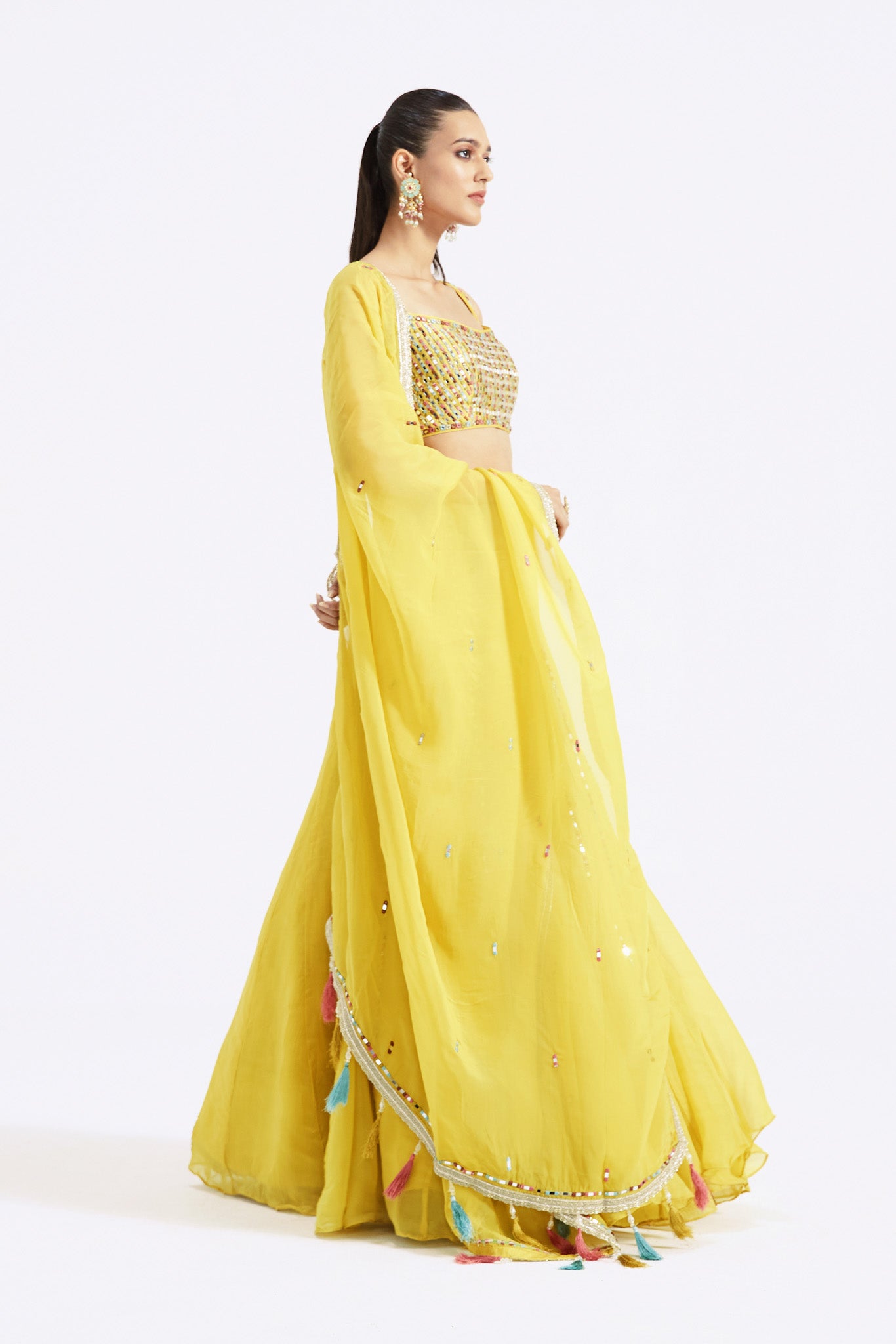 Buy stunning lemon yellow embellished organza lehenga online in USA with dupatta. Shop the best and latest designs in embroidered sarees, designer sarees, Anarkali suit, lehengas, sharara suits for weddings and special occasions from Pure Elegance Indian fashion store in USA.-side