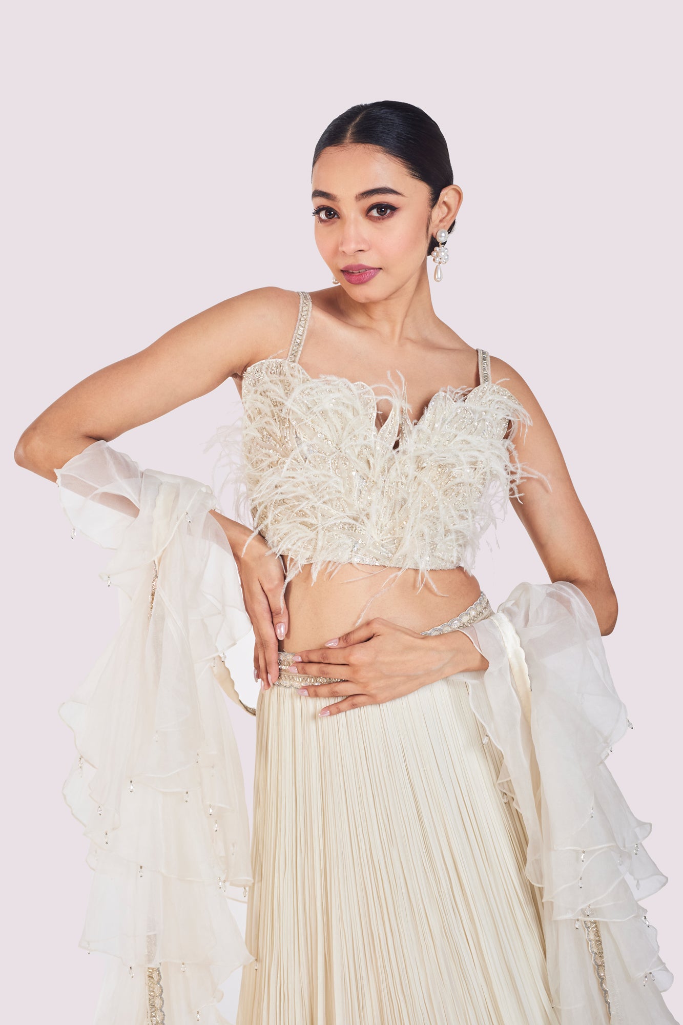 Shop ivory embroidered designer net lehenga online in USA with dupatta. Shop the best and latest designs in embroidered sarees, designer sarees, Anarkali suit, lehengas, sharara suits for weddings and special occasions from Pure Elegance Indian fashion store in USA.-closeup