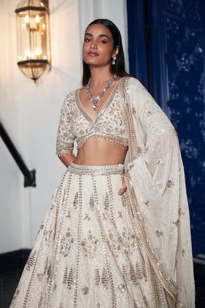 Shop ivory embroidered organza lehenga online in USA with dupatta. Shop the best and latest designs in embroidered sarees, designer sarees, Anarkali suit, lehengas, sharara suits for weddings and special occasions from Pure Elegance Indian fashion store in USA.-blouse