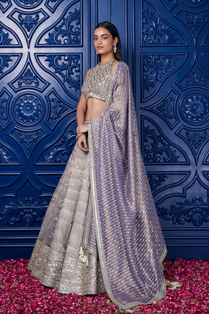 Buy mauve embroidered tissue lehenga online in USA with dupatta. Shop the best and latest designs in embroidered sarees, designer sarees, Anarkali suit, lehengas, sharara suits for weddings and special occasions from Pure Elegance Indian fashion store in USA.-side