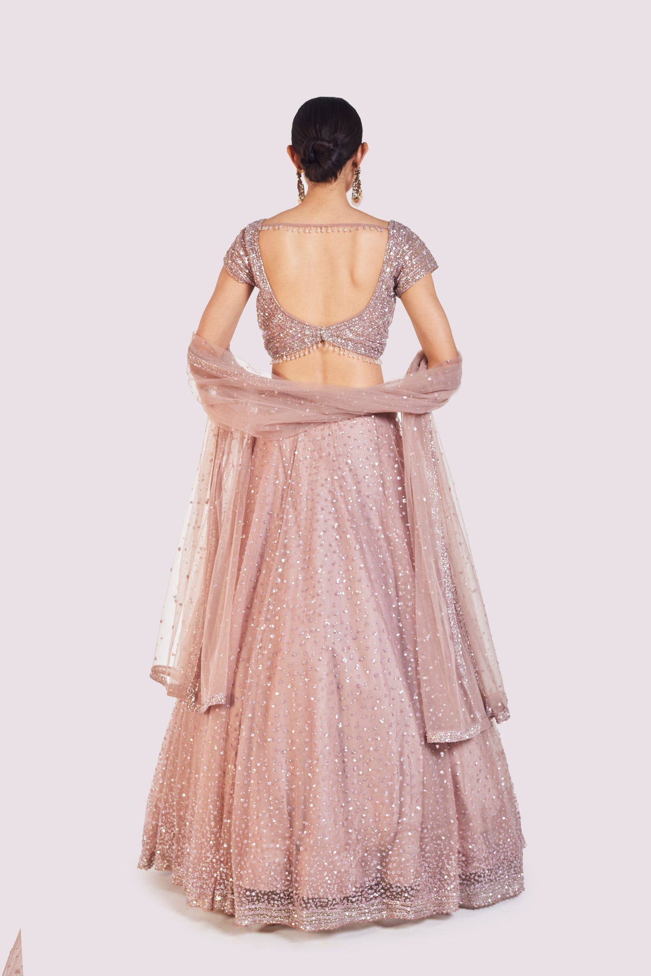 Buy beautiful onion pink embroidered net lehenga online in USA with dupatta. Shop the best and latest designs in embroidered sarees, designer sarees, Anarkali suit, lehengas, sharara suits for weddings and special occasions from Pure Elegance Indian fashion store in USA.-back