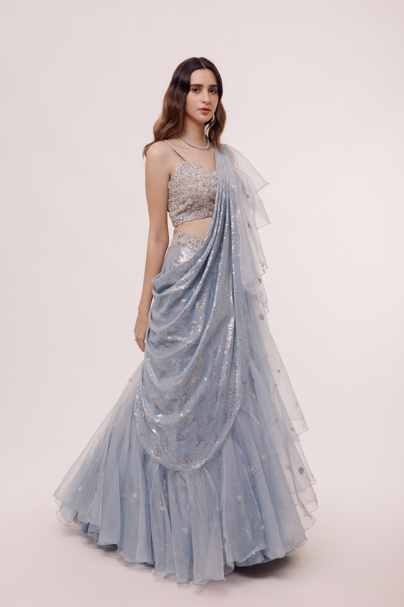 Shop the Look your best on wedding occasions in this pastel blue lehenga with sequin, cut dana work, and ruffle dupatta. Dazzle on weddings and special occasions with exquisite Indian designer dresses, sharara suits, Anarkali suits, bridal lehengas, and sharara suits from Pure Elegance Indian clothing store in the USA. Shop online from Pure Elegance.