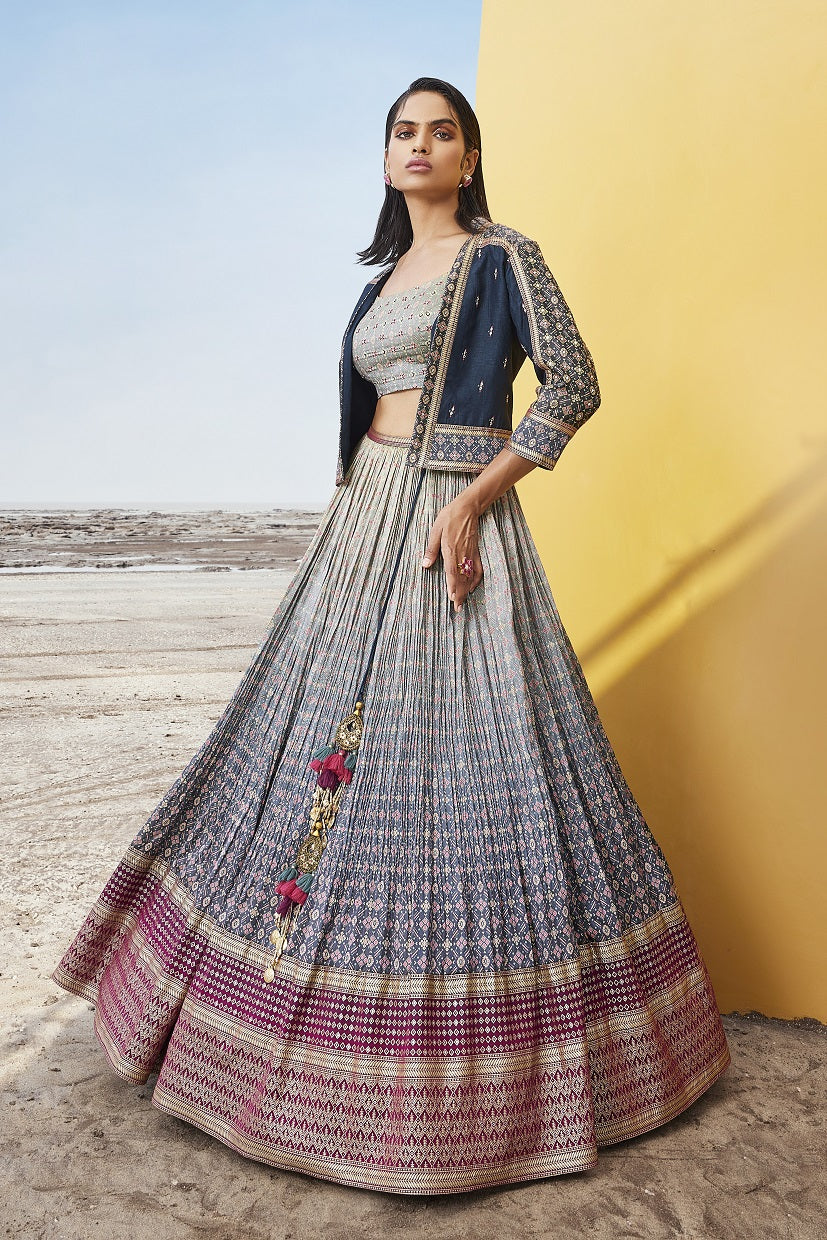 Buy beautiful ombre blue printed chanderi silk lehenga online in USA with jacket. Be the star of the occasions in designer lehengas, embroidered suits, Anarkali dress, designer gowns, sharara suits, Bollywood sarees from Pure Elegance Indian fashion store in USA.-side
