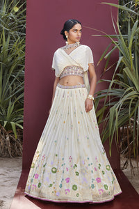 Shop off-white embroidered contemporary georgette lehenga online in USA with dupatta. Be the star of the occasions in designer lehengas, embroidered suits, Anarkali dress, designer gowns, sharara suits, Bollywood sarees from Pure Elegance Indian fashion store in USA.-full view