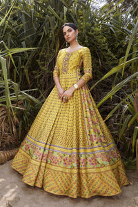 Shop yellow printed silk Anarkali dress online in USA. Be the star of the occasions in designer lehengas, embroidered suits, Anarkali dress, designer gowns, sharara suits, Bollywood sarees from Pure Elegance Indian fashion store in USA.-full view