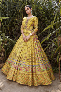 Shop beautiful yellow printed silk Anarkali dress online in USA. Be the star of the occasions in designer lehengas, embroidered suits, Anarkali dress, designer gowns, sharara suits, Bollywood sarIs from Pure Elegance Indian fashion store in USA.-full view