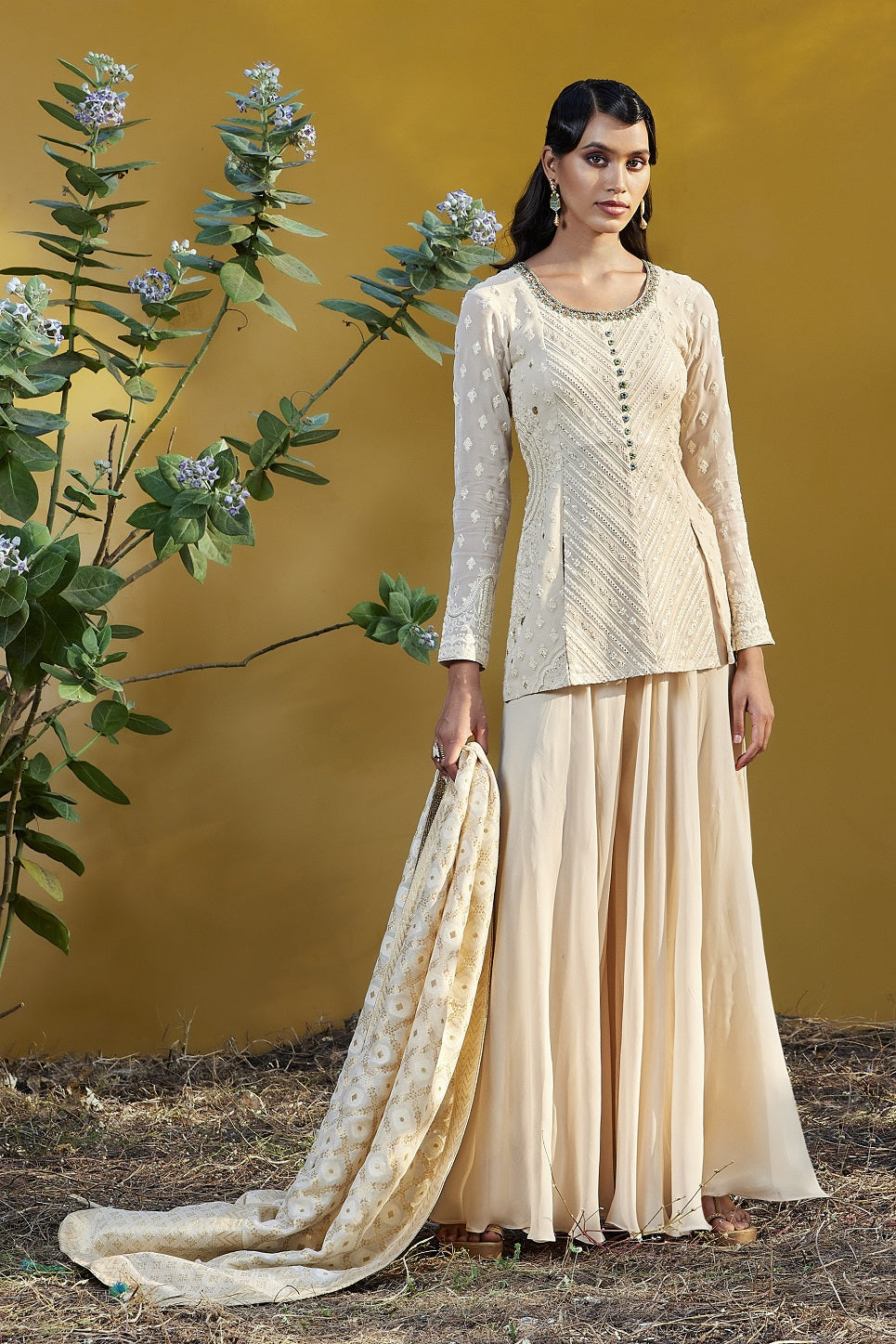 Buy cream embroidered georgette sharara suit online in USA with dupatta. Be the star of the occasions in designer lehengas, embroidered suits, Anarkali dress, designer gowns, sharara suits, Bollywood sarIs from Pure Elegance Indian fashion store in USA.-full view