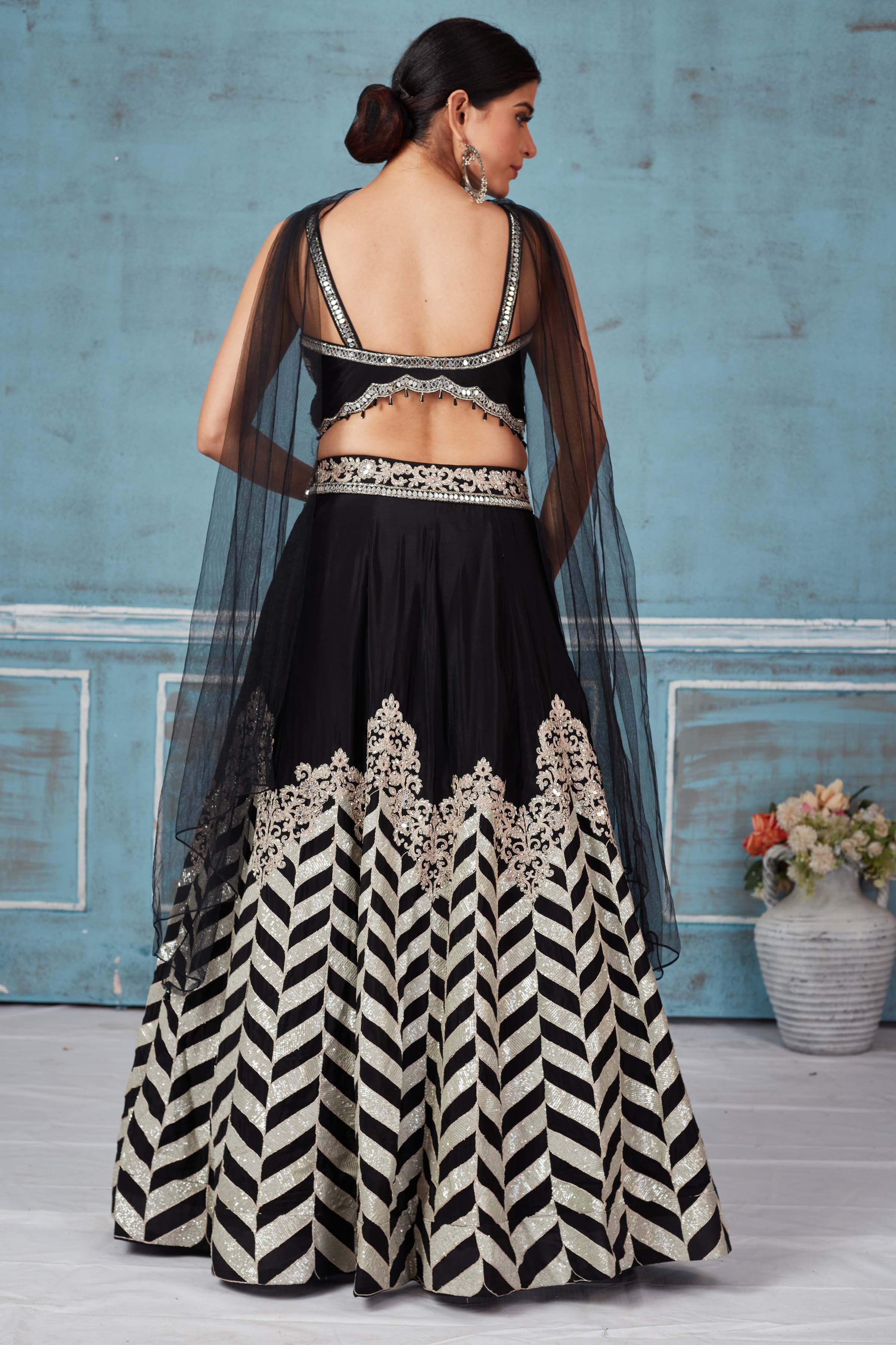 Shop black embroidered silk lehenga online in USA with dupatta. Look royal on special occasions in exquisite designer lehengas, pure silk sarees, handloom sarees, Bollywood sarees, Anarkali suits, Banarasi sarees, organza sarees from Pure Elegance Indian saree store in USA.-back