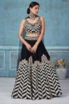 Shop black embroidered silk lehenga online in USA with dupatta. Look royal on special occasions in exquisite designer lehengas, pure silk sarees, handloom sarees, Bollywood sarees, Anarkali suits, Banarasi sarees, organza sarees from Pure Elegance Indian saree store in USA.-full view