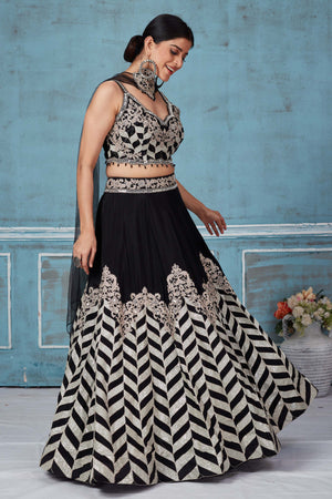 Shop black embroidered silk lehenga online in USA with dupatta. Look royal on special occasions in exquisite designer lehengas, pure silk sarees, handloom sarees, Bollywood sarees, Anarkali suits, Banarasi sarees, organza sarees from Pure Elegance Indian saree store in USA.-side