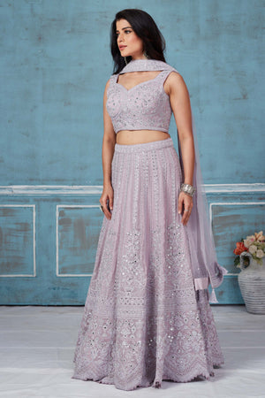 Buy lilac heavy embroidery georgette lehenga online in USA with dupatta. Look royal on special occasions in exquisite designer lehengas, pure silk sarees, handloom sarees, Bollywood sarees, Anarkali suits, Banarasi sarees, organza sarees from Pure Elegance Indian saree store in USA.-side