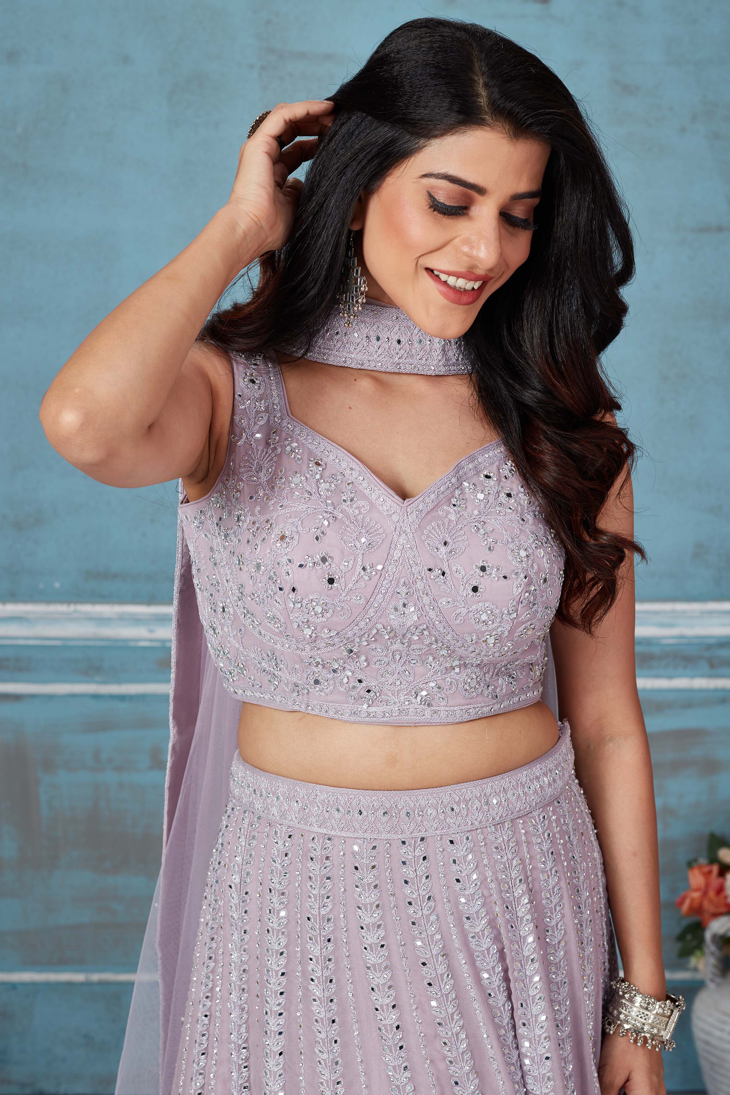 Buy lilac heavy embroidery georgette lehenga online in USA with dupatta. Look royal on special occasions in exquisite designer lehengas, pure silk sarees, handloom sarees, Bollywood sarees, Anarkali suits, Banarasi sarees, organza sarees from Pure Elegance Indian saree store in USA.-closeup