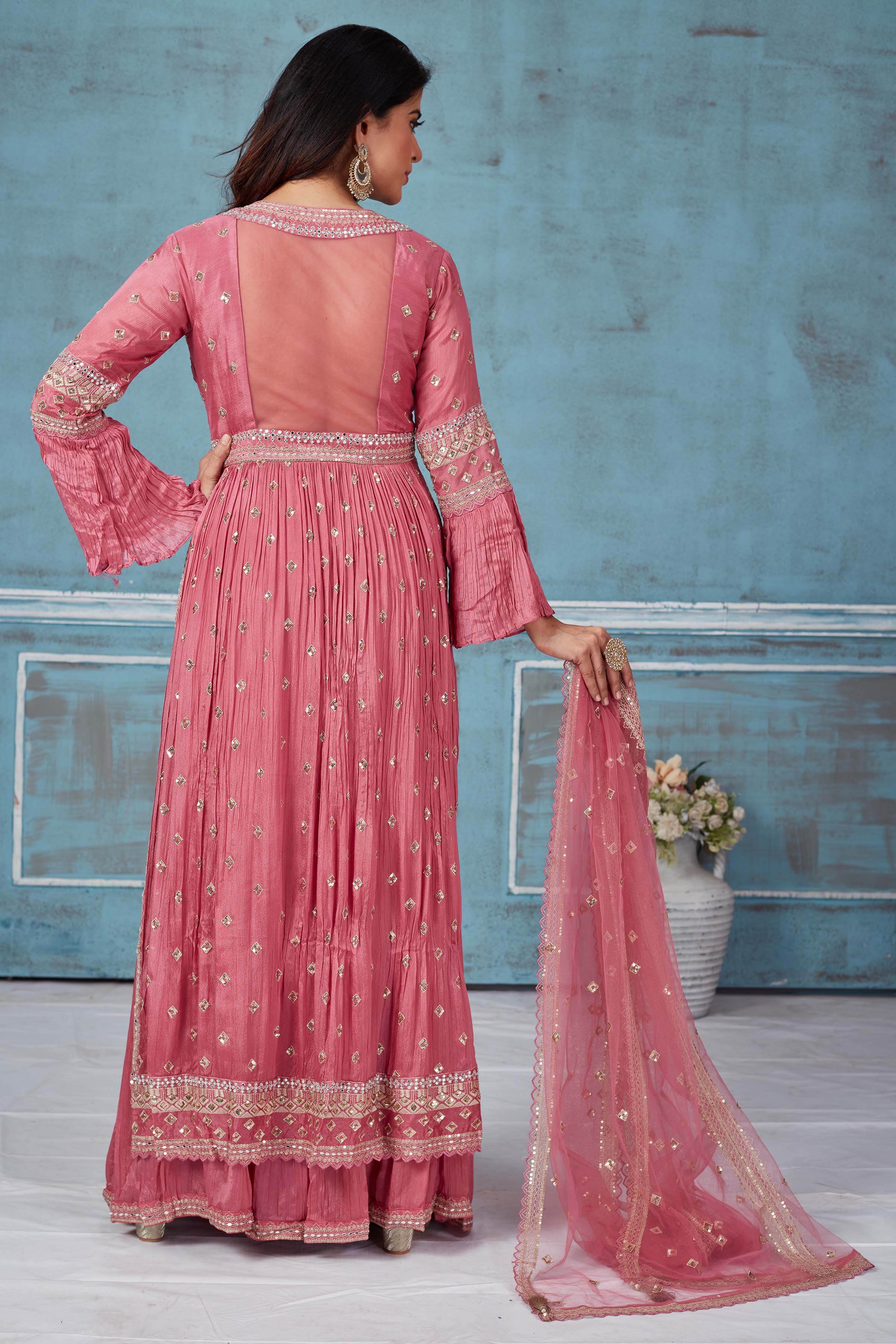 Buy pink embroidered crepe silk palazzo suit online in USA with dupatta. Look royal on special occasions in exquisite designer lehengas, pure silk sarees, handloom sarees, Bollywood sarees, Anarkali suits, Banarasi sarees, organza sarees from Pure Elegance Indian saree store in USA.-back