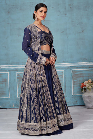 Buy beautiful navy blue embroidered georgette lehenga online in USA with jacket. Look royal on special occasions in exquisite designer lehengas, pure silk sarees, handloom sarees, Bollywood sarees, Anarkali suits, Banarasi sarees, organza sarees from Pure Elegance Indian saree store in USA.-side