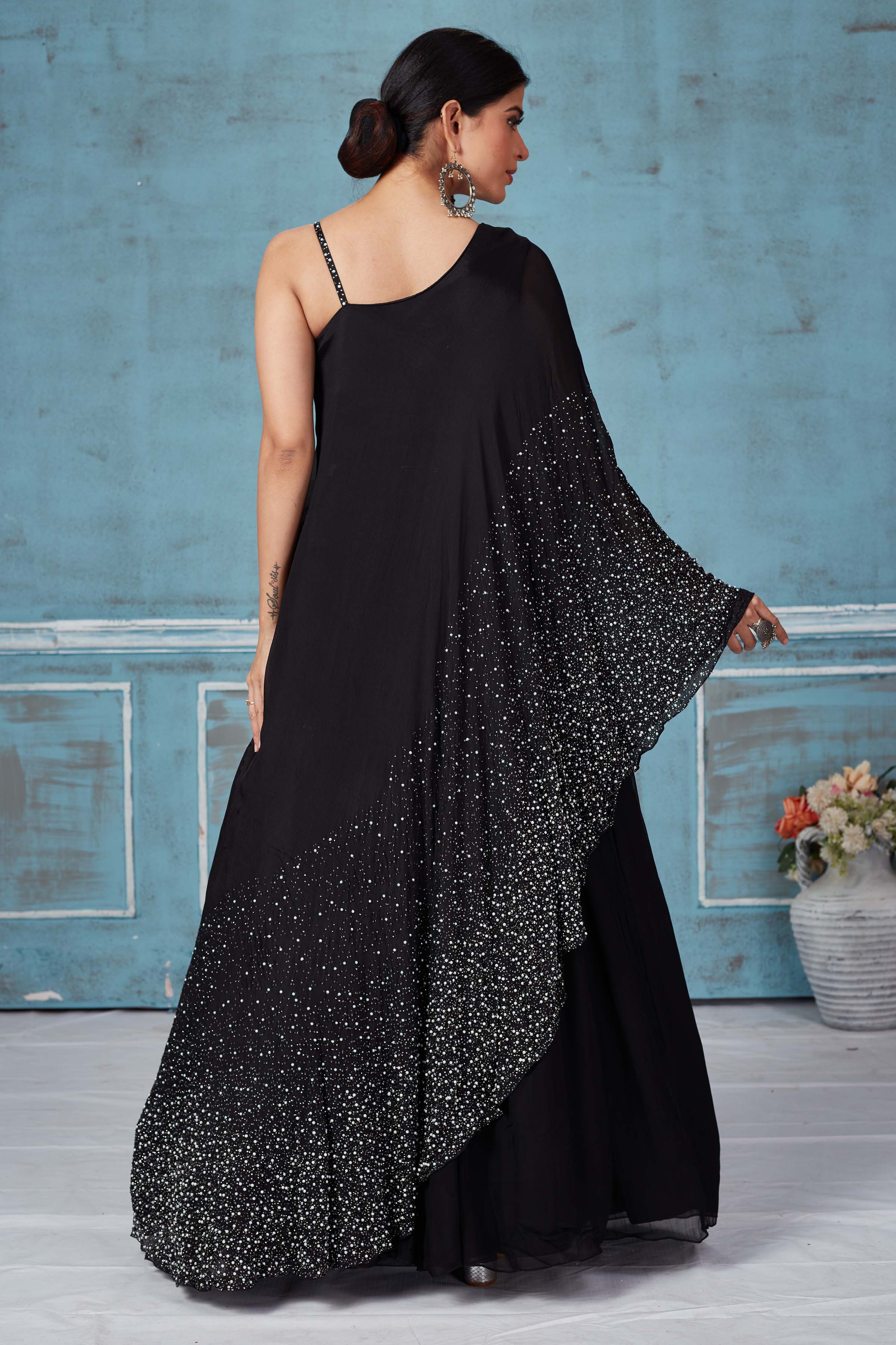 Shop stunning black embroidered crepe silk top online in USA with skirt. Look royal on special occasions in exquisite designer lehengas, pure silk sarees, handloom sarees, Bollywood sarees, Anarkali suits, Banarasi sarees, organza sarees from Pure Elegance Indian saree store in USA.-back