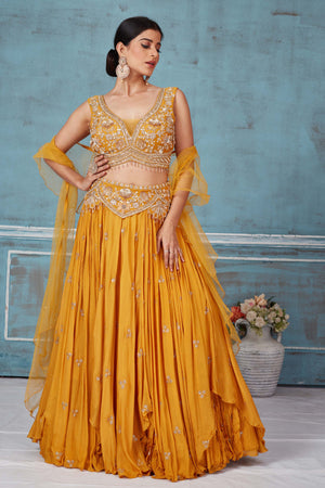 Shop beautiful mustard hand embroidered georgette lehenga online in USA with dupatta. Look royal on special occasions in exquisite designer lehengas, pure silk sarees, handloom sarees, Bollywood sarees, Anarkali suits, Banarasi sarees, organza sarees from Pure Elegance Indian saree store in USA.-front