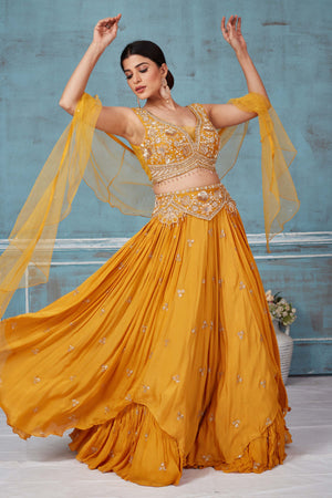 Shop beautiful mustard hand embroidered georgette lehenga online in USA with dupatta. Look royal on special occasions in exquisite designer lehengas, pure silk sarees, handloom sarees, Bollywood sarees, Anarkali suits, Banarasi sarees, organza sarees from Pure Elegance Indian saree store in USA.-side
