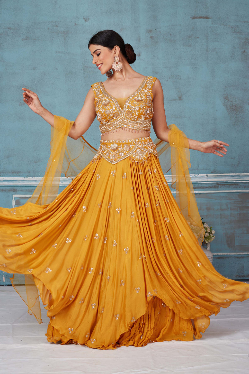 Shop beautiful mustard hand embroidered georgette lehenga online in USA with dupatta. Look royal on special occasions in exquisite designer lehengas, pure silk sarees, handloom sarees, Bollywood sarees, Anarkali suits, Banarasi sarees, organza sarees from Pure Elegance Indian saree store in USA.-full view