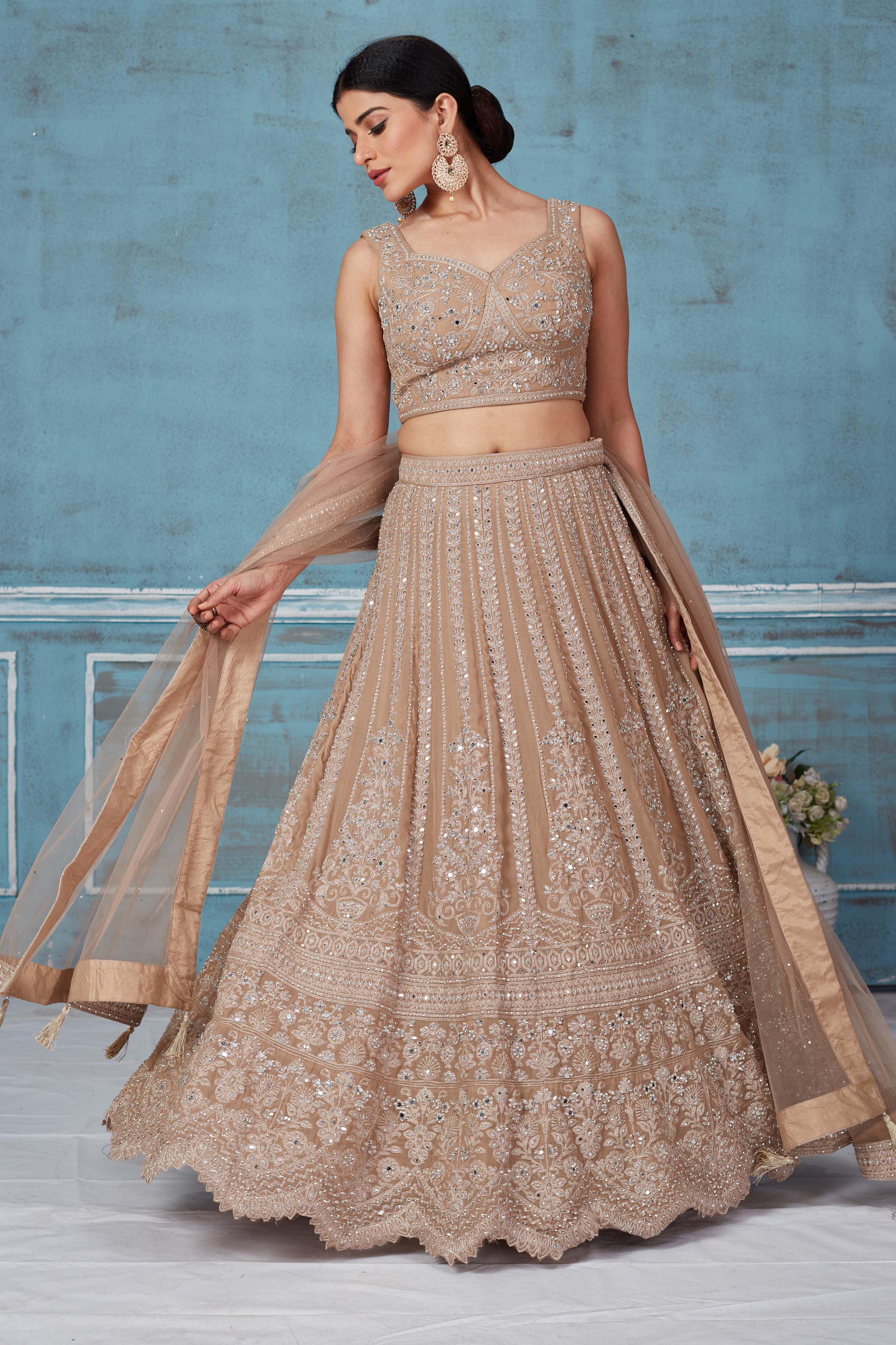 Buy beige embroidered designer lehenga online in USA with dupatta. Look royal on special occasions in exquisite designer lehengas, pure silk sarees, handloom sarees, Bollywood sarees, Anarkali suits, Banarasi sarees, organza sarees from Pure Elegance Indian saree store in USA.-front