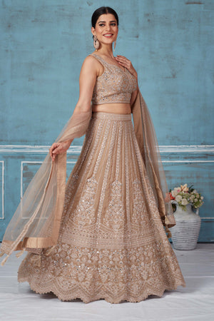 Buy beige embroidered designer lehenga online in USA with dupatta. Look royal on special occasions in exquisite designer lehengas, pure silk sarees, handloom sarees, Bollywood sarees, Anarkali suits, Banarasi sarees, organza sarees from Pure Elegance Indian saree store in USA.-side