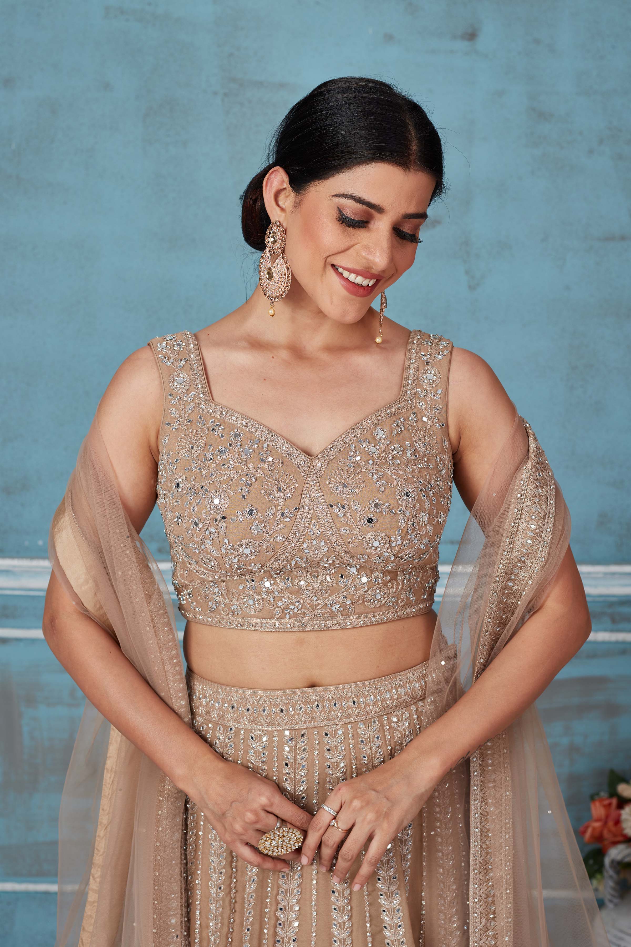 Buy beige embroidered designer lehenga online in USA with dupatta. Look royal on special occasions in exquisite designer lehengas, pure silk sarees, handloom sarees, Bollywood sarees, Anarkali suits, Banarasi sarees, organza sarees from Pure Elegance Indian saree store in USA.-closeup