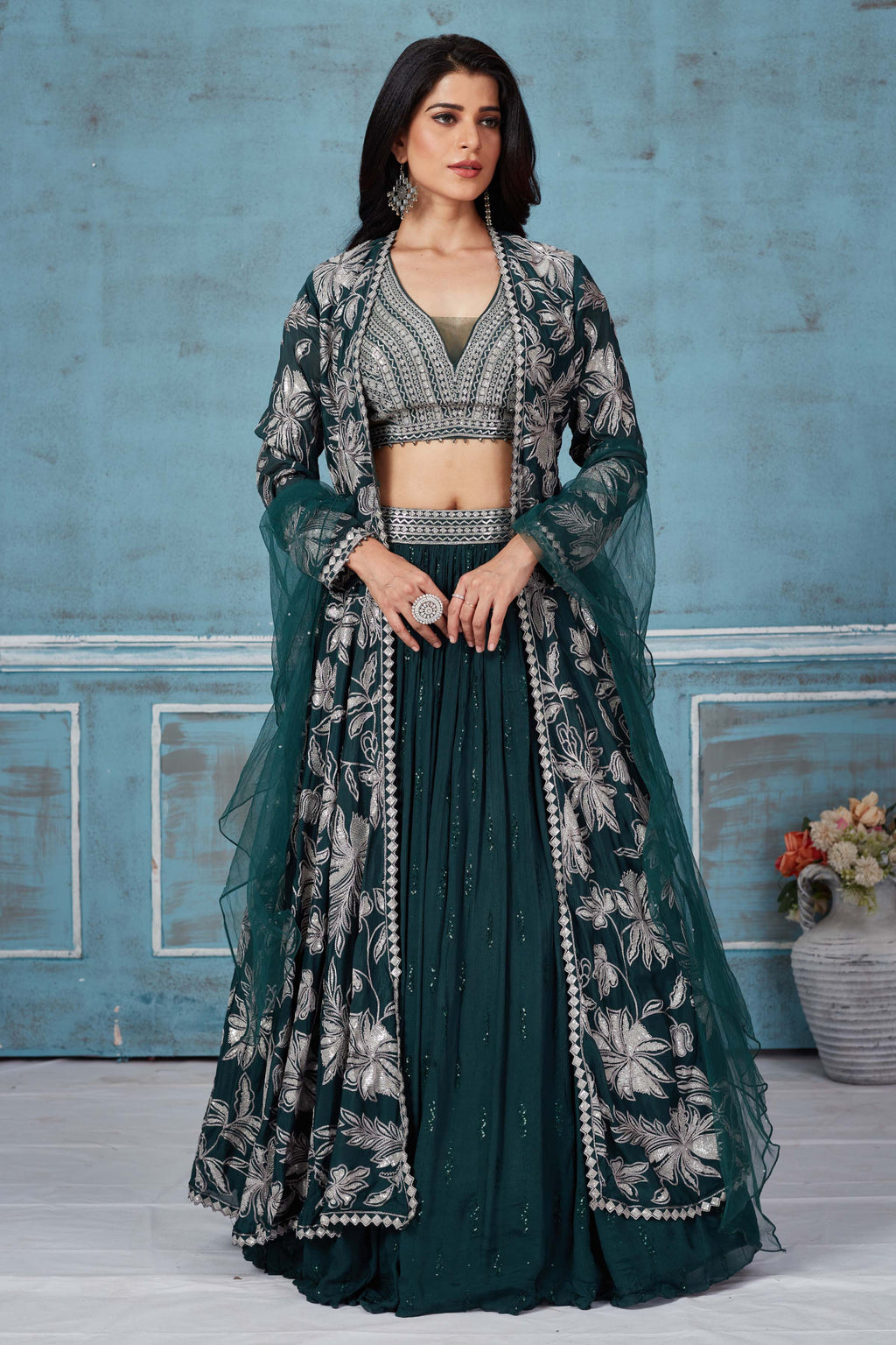 Buy dark green embroidered lehenga online in USA with jacket. Look royal on special occasions in exquisite designer lehengas, pure silk sarees, handloom sarees, Bollywood sarees, Anarkali suits, Banarasi sarees, organza sarees from Pure Elegance Indian saree store in USA.-full view
