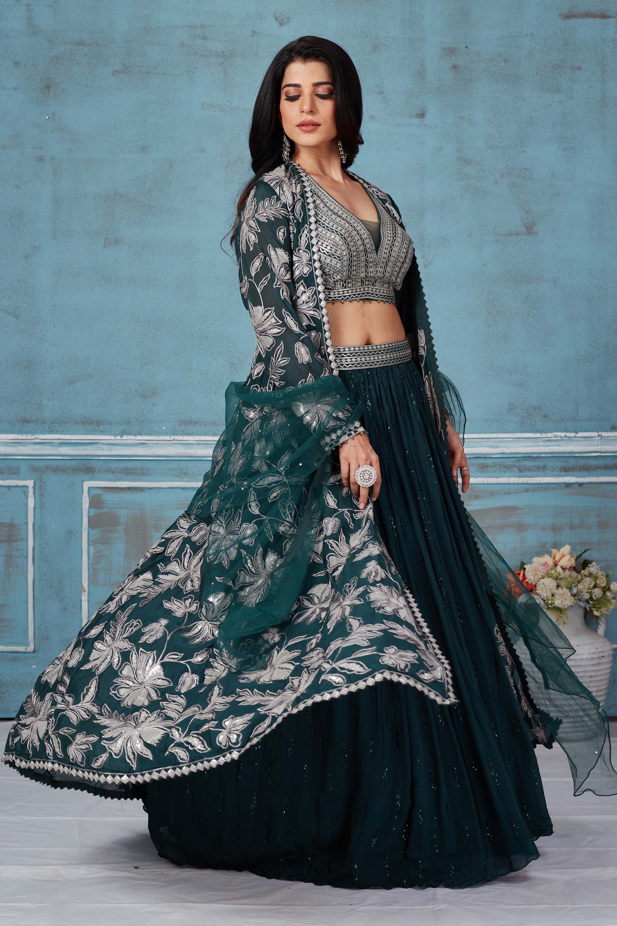 Buy dark green embroidered lehenga online in USA with jacket. Look royal on special occasions in exquisite designer lehengas, pure silk sarees, handloom sarees, Bollywood sarees, Anarkali suits, Banarasi sarees, organza sarees from Pure Elegance Indian saree store in USA.-side