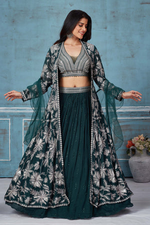 Buy dark green embroidered lehenga online in USA with jacket. Look royal on special occasions in exquisite designer lehengas, pure silk sarees, handloom sarees, Bollywood sarees, Anarkali suits, Banarasi sarees, organza sarees from Pure Elegance Indian saree store in USA.-front