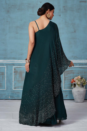 Shop dark green one shoulder georgette dress online in USA. Look royal on special occasions in exquisite designer lehengas, pure silk sarees, handloom sarees, Bollywood sarees, Anarkali suits, Banarasi sarees, organza sarees from Pure Elegance Indian saree store in USA.-back