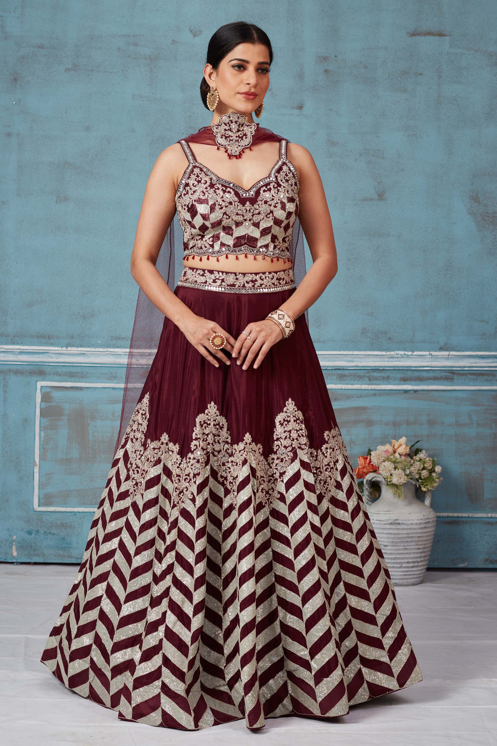 Buy maroon embroidered silk designer lehenga online in USA with dupatta. Look royal on special occasions in exquisite designer lehengas, pure silk sarees, handloom sarees, Bollywood sarees, Anarkali suits, Banarasi sarees, organza sarees from Pure Elegance Indian saree store in USA.-full view