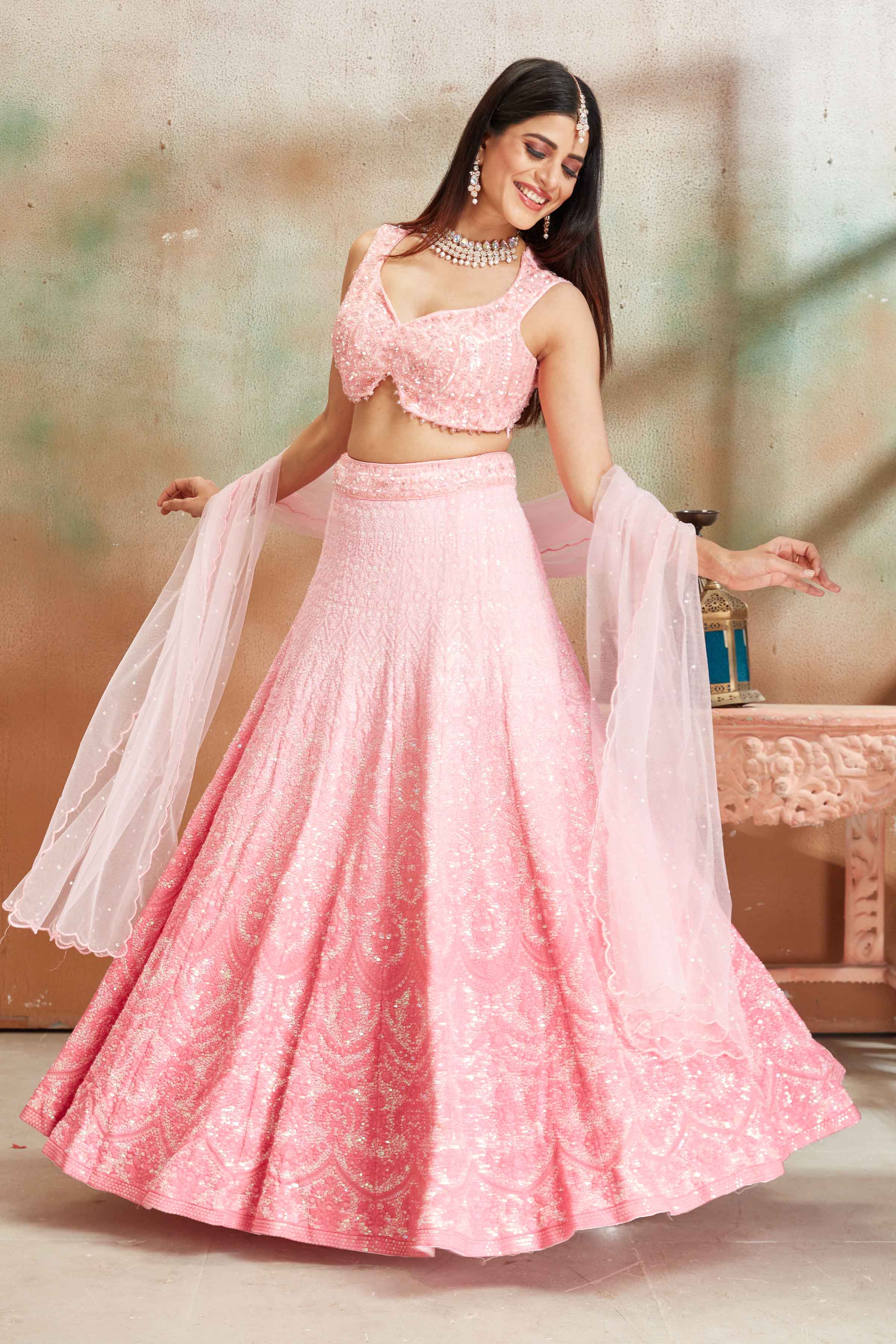 Shop ombre pink Lucknowi georgette lehenga online in USA with dupatta. Look your best on festive occasions in latest designer saris, pure silk sarees, Kanjivaram silk sarees, handwoven saris, tussar silk sarees, embroidered saris from Pure Elegance Indian clothing store in USA.-side