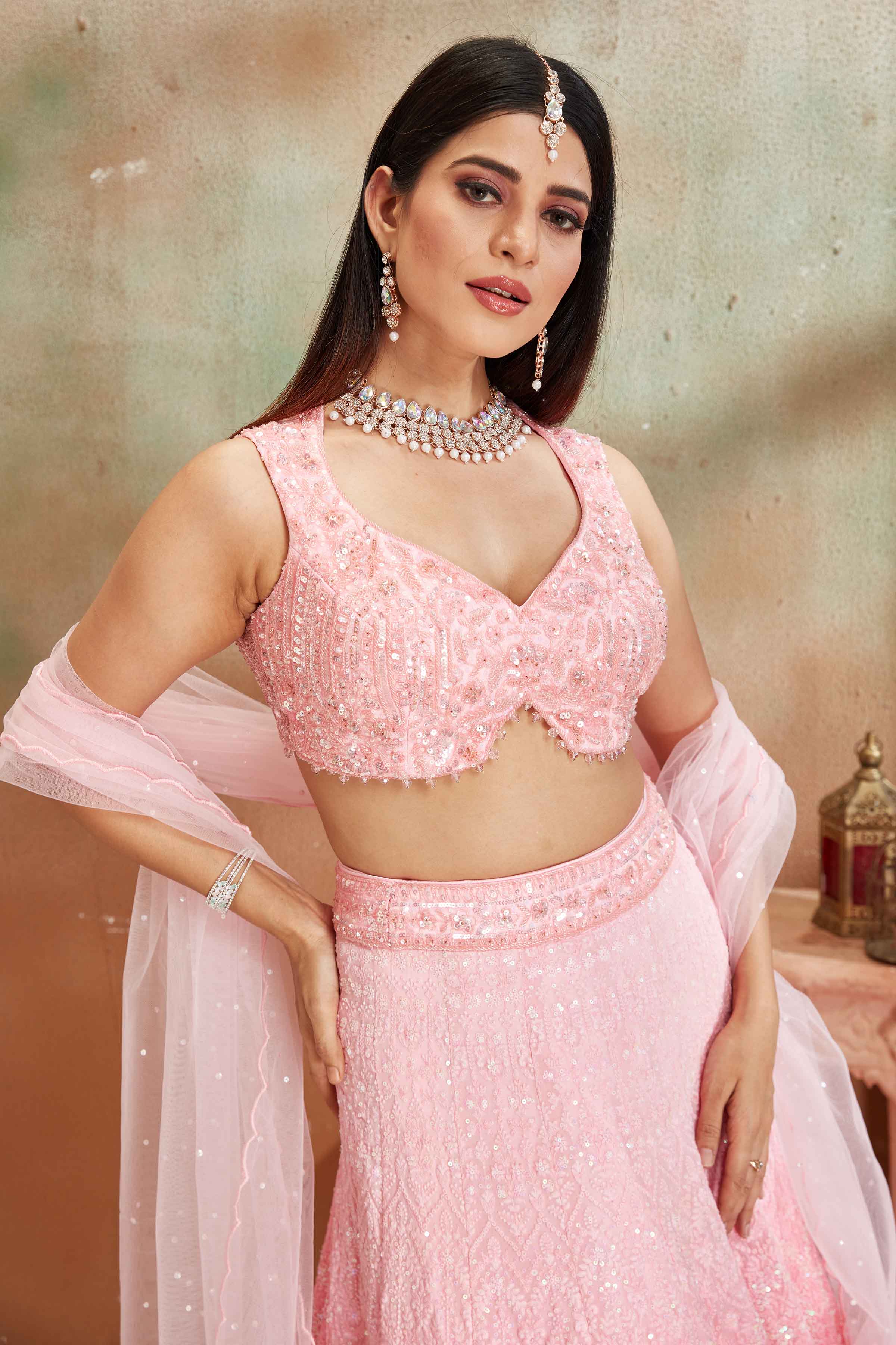 Shop ombre pink Lucknowi georgette lehenga online in USA with dupatta. Look your best on festive occasions in latest designer saris, pure silk sarees, Kanjivaram silk sarees, handwoven saris, tussar silk sarees, embroidered saris from Pure Elegance Indian clothing store in USA.-closeup