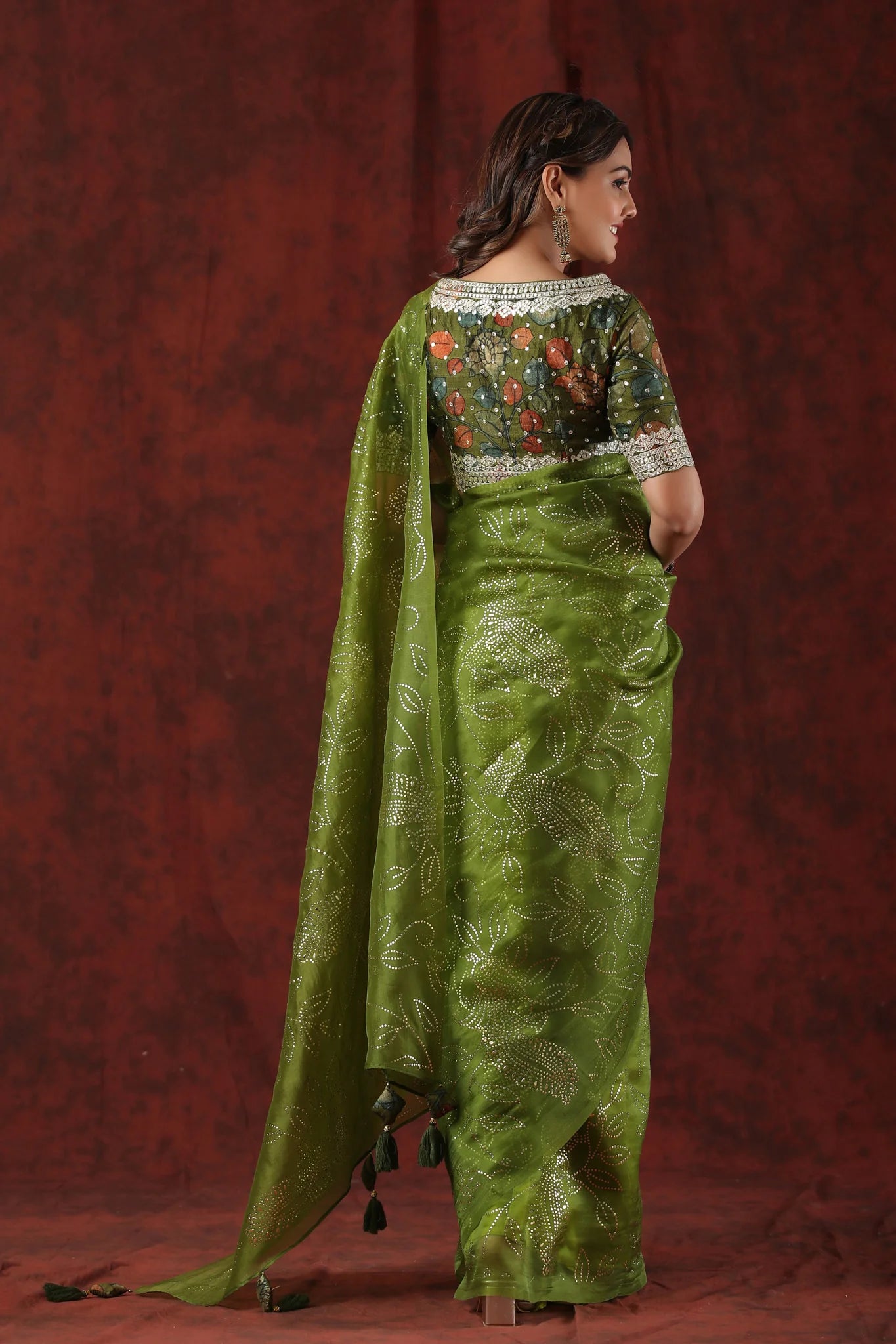 Buy green embellished organza silk saree online in USA with blouse. Look royal on special occasions in exquisite designer sarees, pure silk sarees, handloom sarees, Bollywood sarees, embroidered sarees, Banarasi sarees, organza sarees from Pure Elegance Indian saree store in USA.-back