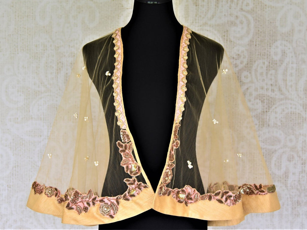 Shop cream hand embroidered net designer cape blouse online in USA. Complete your ethnic saree look with designer blouses, readymade sari blouse, embroidered saree blouse from Pure Elegance Indian saree store in USA.-FRONT