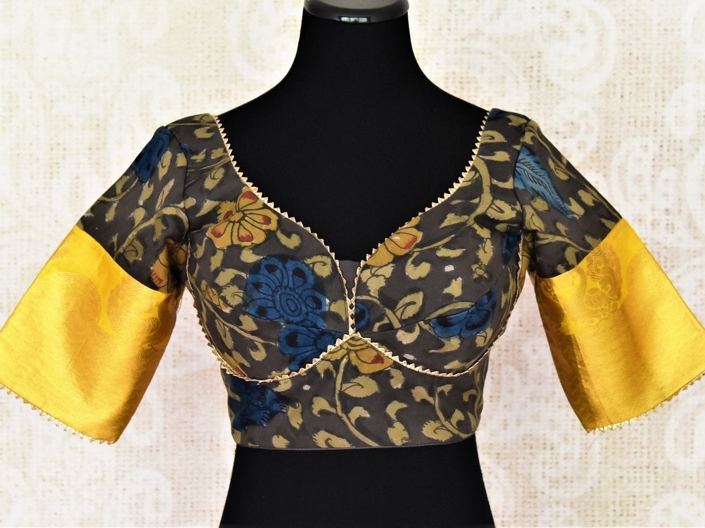 Shop beautiful dark grey Kalamkari silk saree blouse online in USA with yellow zari sleeves. Go for a perfect saree style with latest designer saree blouses, pure silk blouse, choli-cut saree blouses, readymade sarees blouse, padded saree blouses from Pure Elegance Indian saree store in USA.-full view