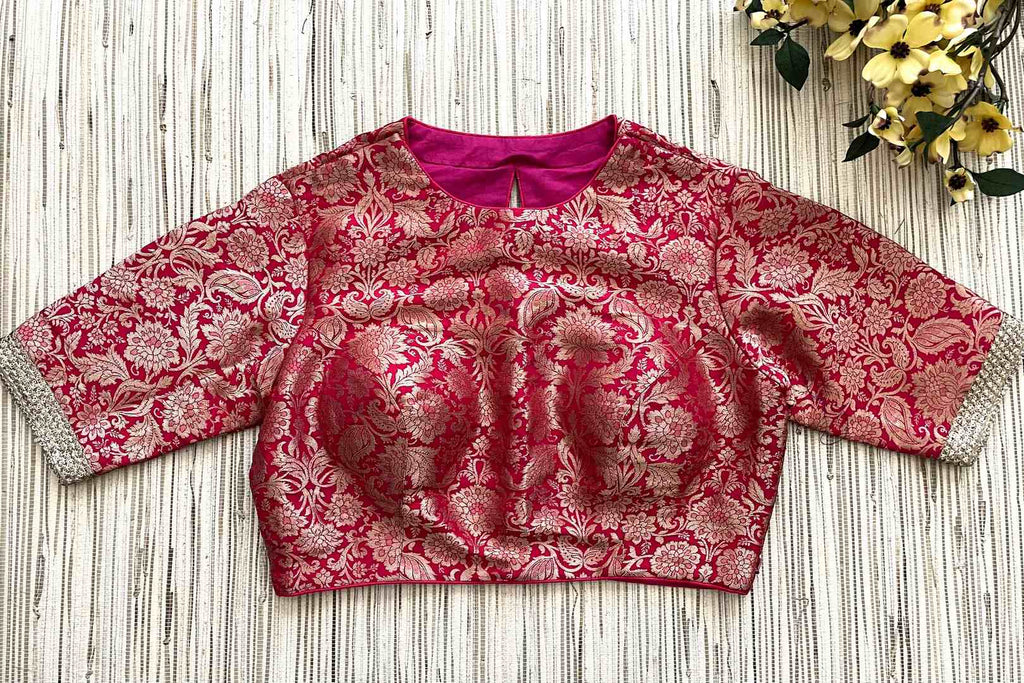 Shop dark pink Banarasi sari blouse online in USA with golden lace. Elevate your saree style with exquisite readymade sari blouses, embroidered saree blouses, Banarasi sari blouse, designer saree blouse, choli-cut blouses, corset blouses from Pure Elegance Indian fashion store in USA.-front