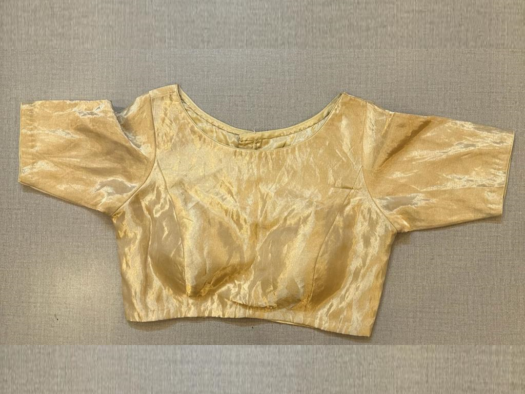 Shop cream tissue saree blouse online in USA with elbow sleeves. Pair your sarees with elegant sarees blouses, designer blouses, embroidered blouses, choli-cut blouses, bridal blouses, cotton saree blouses for a beautiful ethnic look. Shop from Pure Elegance Indian saree store in USA.-full view