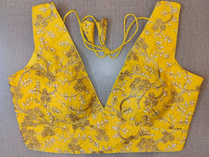 Shop beautiful yellow sleeveless saree blouse online in USA with golden embroidery. Elevate your Indian saree style with exquisite readymade sari blouse, embroidered saree blouses, Banarasi saree blouse, designer sari blouse, choli-cut blouses from Pure Elegance Indian clothing store in USA.-full view