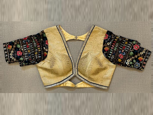 Buy golden saree blouse online in USA with black multicolor embroidery sleeves. Elevate your saree style with exquisite readymade saree blouses, embroidered saree blouses, Banarasi sari blouse, designer sari blouse, choli-cut blouse, corset blouses from Pure Elegance Indian fashion store in USA.-full view