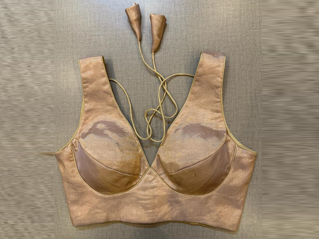 Buy rose gold tissue sleeveless designer saree blouse online in USA. Elevate your saree style with exquisite readymade sari blouses, embroidered saree blouses, Banarasi sari blouse, designer saree blouse, choli-cut blouses, corset blouses from Pure Elegance Indian fashion store in USA.-full view