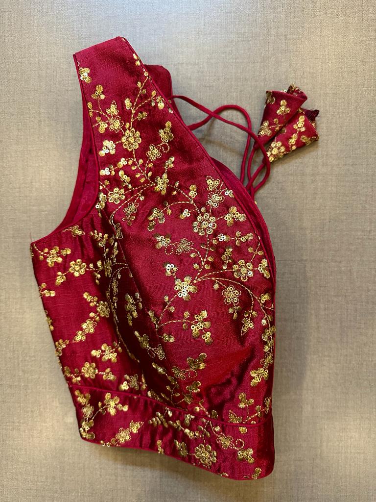 Buy maroon sleeveless saree blouse online in USA with golden embroidery. Elevate your saree style with exquisite readymade sari blouses, embroidered saree blouses, Banarasi sari blouse, designer saree blouse, choli-cut blouses, corset blouses from Pure Elegance Indian fashion store in USA.-side