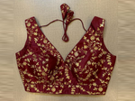 Buy dark maroon sleeveless saree blouse online in USA with golden embroidery. Elevate your saree style with exquisite readymade sari blouses, embroidered saree blouses, Banarasi sari blouse, designer saree blouse, choli-cut blouses, corset blouses from Pure Elegance Indian fashion store in USA.-full view