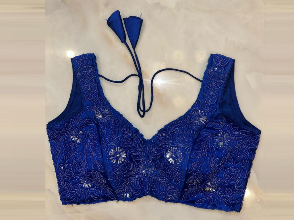 Buy cobalt blue hand embroidered sleeveless saree blouse online in USA. Elevate your saree style with exquisite readymade sari blouses, embroidered saree blouses, Banarasi sari blouse, designer saree blouse, choli-cut blouses, corset blouses from Pure Elegance Indian fashion store in USA.-full view