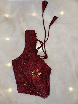 Shop maroon hand embroidered sleeveless saree blouse online in USA. Elevate your saree style with exquisite readymade sari blouses, embroidered saree blouses, Banarasi sari blouse, designer saree blouse, choli-cut blouses, corset blouses from Pure Elegance Indian fashion store in USA.-side