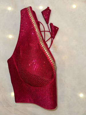 Shop magenta sequin sleeveless saree blouse online in USA with sequin lace. Elevate your saree style with exquisite readymade sari blouses, embroidered saree blouses, Banarasi sari blouse, designer saree blouse, choli-cut blouses, corset blouses from Pure Elegance Indian fashion store in USA.-side