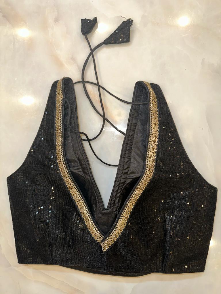 Buy black sequin sleeveless saree blouse online in USA with sequin lace. Elevate your saree style with exquisite readymade sari blouses, embroidered saree blouses, Banarasi sari blouse, designer saree blouse, choli-cut blouses, corset blouses from Pure Elegance Indian fashion store in USA.-back
