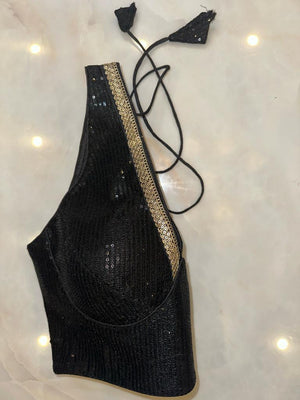 Buy black sequin sleeveless saree blouse online in USA with sequin lace. Elevate your saree style with exquisite readymade sari blouses, embroidered saree blouses, Banarasi sari blouse, designer saree blouse, choli-cut blouses, corset blouses from Pure Elegance Indian fashion store in USA.-side
