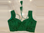 Buy green hand embroidered sleeveless saree blouse online in USA. Elevate your saree style with exquisite readymade sari blouses, embroidered saree blouses, Banarasi sari blouse, designer saree blouse, choli-cut blouses, corset blouses from Pure Elegance Indian fashion store in USA.-full view